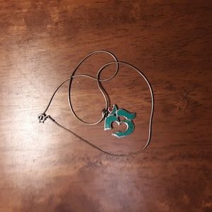 Turquoise and silver pendant.